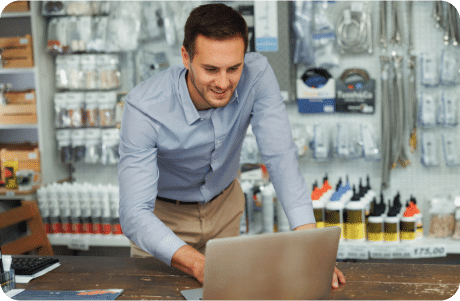 Man checking his tax credits on a laptop at work