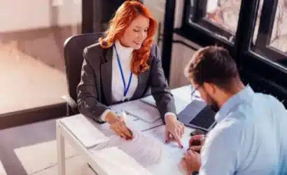 Two professionals having a conversation in a meeting