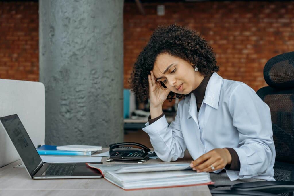 Female accountant looking through accounting documents
